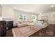 Spacious living room boasts fireplace, large sofa, and hardwood flooring at 269 Keating Place Dr, Fort Mill, SC 29708
