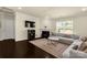 Comfortable living room with a fireplace, TV, and plush sectional sofa, perfect for relaxation at 269 Keating Place Dr, Fort Mill, SC 29708