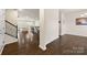 Inviting living room featuring hardwood floors, an open layout, and staircase access at 269 Keating Place Dr, Fort Mill, SC 29708