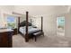 This main bedroom features carpeted floors and a four poster bed; a Primary bath is visible at 269 Keating Place Dr, Fort Mill, SC 29708