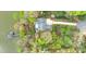 Aerial view of the home and waterfront property with mature landscaping, including a private dock at 272 Harbor Ridge Dr, Statesville, NC 28677