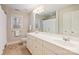 Bathroom with a double sink vanity, large mirror, and tiled floor at 272 Harbor Ridge Dr, Statesville, NC 28677