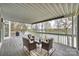Covered deck with comfortable seating and scenic lake views at 272 Harbor Ridge Dr, Statesville, NC 28677