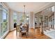 Sunlit breakfast nook features hardwood floors, bay window and lake views at 272 Harbor Ridge Dr, Statesville, NC 28677