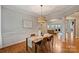 Elegant dining area featuring hardwood floors and a stylish light fixture at 272 Harbor Ridge Dr, Statesville, NC 28677
