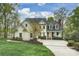 Inviting two-story traditional home with a charming front porch and well-manicured lawn and a private drive at 272 Harbor Ridge Dr, Statesville, NC 28677