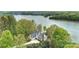 Spacious waterfront home with lush landscaping and a private lake view at 272 Harbor Ridge Dr, Statesville, NC 28677