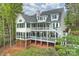 Back exterior of a multi-story home with multiple porches perfect for entertaining and scenic views at 272 Harbor Ridge Dr, Statesville, NC 28677