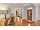 Elegant foyer featuring hardwood floors, natural wood accents, and an open view into the study at 272 Harbor Ridge Dr, Statesville, NC 28677
