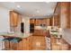Kitchen features wood cabinets, granite countertops, stainless appliances, and hardwood floors at 272 Harbor Ridge Dr, Statesville, NC 28677