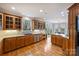 Spacious kitchen with custom wood cabinets, stainless steel dishwasher, and granite countertops at 272 Harbor Ridge Dr, Statesville, NC 28677