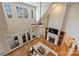 High angle of a living room with a fireplace, hardwood floors, high ceilings, and lake views at 272 Harbor Ridge Dr, Statesville, NC 28677