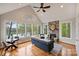 Bright living room with hardwood floors, fireplace, vaulted ceiling, and lake views at 272 Harbor Ridge Dr, Statesville, NC 28677