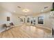 Bright living room with hardwood floors, fireplace, and french doors leading to outdoor space at 272 Harbor Ridge Dr, Statesville, NC 28677