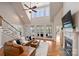 Spacious living room boasts high ceilings, large windows with lake views, and a cozy fireplace at 272 Harbor Ridge Dr, Statesville, NC 28677