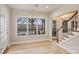 Bright living room with large window offering a beautiful lake view and staircase to the upper level at 272 Harbor Ridge Dr, Statesville, NC 28677