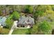 Stunning aerial view of a home featuring mature trees and a manicured yard and brick exterior at 305 Caledonia Way, Waxhaw, NC 28173