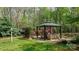 Inviting backyard gazebo offering a tranquil outdoor retreat surrounded by nature at 305 Caledonia Way, Waxhaw, NC 28173