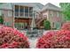 Spacious backyard featuring an outdoor seating area, mature trees and a well-maintained lawn at 305 Caledonia Way, Waxhaw, NC 28173