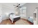 Bedroom featuring a bed, a large window, and an accent chair, all enhancing its cozy appeal at 305 Caledonia Way, Waxhaw, NC 28173