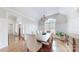 Bright dining room with hardwood floors, white wainscoting, and a chandelier at 305 Caledonia Way, Waxhaw, NC 28173