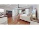 Cozy main bedroom with hardwood floors, ceiling fan, and ensuite bathroom at 305 Caledonia Way, Waxhaw, NC 28173