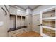 Mudroom featuring built-in storage, coat hooks, a bench, and neutral walls with decorative paneling at 305 Caledonia Way, Waxhaw, NC 28173