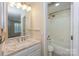 Bright bathroom featuring a granite vanity and a shower-tub combination for optimal convenience and style at 368 Northwest Dr, Davidson, NC 28036