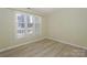 Well-lit bedroom featuring a window with white blinds, providing abundant natural light and comfort at 368 Northwest Dr, Davidson, NC 28036