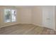 Cozy bedroom filled with natural light through the bright window, complemented by neutral paint and flooring at 368 Northwest Dr, Davidson, NC 28036
