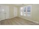 Bedroom with a closet and a window with white blinds, offering natural light and ample storage at 368 Northwest Dr, Davidson, NC 28036