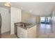 Cozy kitchen with breakfast bar, granite counters, and stainless steel appliances at 368 Northwest Dr, Davidson, NC 28036