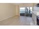 Bright living room showcases tile floors, sliding glass doors to the balcony, and a cozy fireplace at 368 Northwest Dr, Davidson, NC 28036
