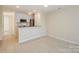 Open living space with tile floors next to a well-lit kitchen at 368 Northwest Dr, Davidson, NC 28036