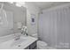 Cozy bathroom with a shower, vanity, sink, and decorative accents at 4056 Zilker Park Dr, Charlotte, NC 28217