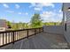 Outdoor deck with wood flooring and railing offers neighborhood views at 4056 Zilker Park Dr, Charlotte, NC 28217