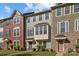 Charming townhomes with varied colors, manicured lawns, and inviting entrances showcase curb appeal at 4056 Zilker Park Dr, Charlotte, NC 28217
