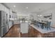 Open kitchen features stainless steel appliances, a central island, and a view of dining area at 4056 Zilker Park Dr, Charlotte, NC 28217
