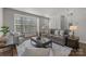 Inviting living room featuring a large window, comfortable seating, and neutral decor at 4056 Zilker Park Dr, Charlotte, NC 28217