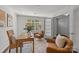 Bright home office with ample natural light, stylish furnishings, and a calming, neutral color scheme at 4056 Zilker Park Dr, Charlotte, NC 28217