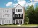 New three-story home with black and white siding and landscaped front yard at 4124 Skyboat Cir, Fort Mill, SC 29715