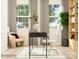 Bright home office design featuring light wood floors, neutral walls, with black desk and white ergonomic chair at 4124 Skyboat Cir, Fort Mill, SC 29715