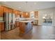 Spacious kitchen featuring an island with stone countertops, stainless steel appliances, and wooden cabinets at 4176 River Run Cir, Hickory, NC 28602