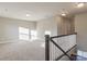 Open loft area with plush carpeting and ample natural light, ideal for a play area or additional living space at 4176 River Run Cir, Hickory, NC 28602
