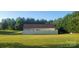 Spacious backyard with a well-maintained lawn and white privacy fence at 426 Summer Ridge Rd, Stanley, NC 28164