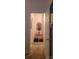 Bright hallway featuring a stylish mirror, decor table, and neutral walls, leading to various rooms at 426 Summer Ridge Rd, Stanley, NC 28164