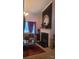 Inviting living room with a stone fireplace, leather sofa, and plenty of natural light from the windows at 426 Summer Ridge Rd, Stanley, NC 28164
