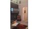 Cozy living space with plush carpet, accent wall, mounted TV, and an arched doorway at 426 Summer Ridge Rd, Stanley, NC 28164