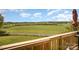 A picturesque backyard provides views of the white fence and expansive field at 44392 Dennis Rd, Albemarle, NC 28001