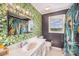 This is a colorful bathroom with tropical leaf wallpaper and modern fixtures at 44392 Dennis Rd, Albemarle, NC 28001